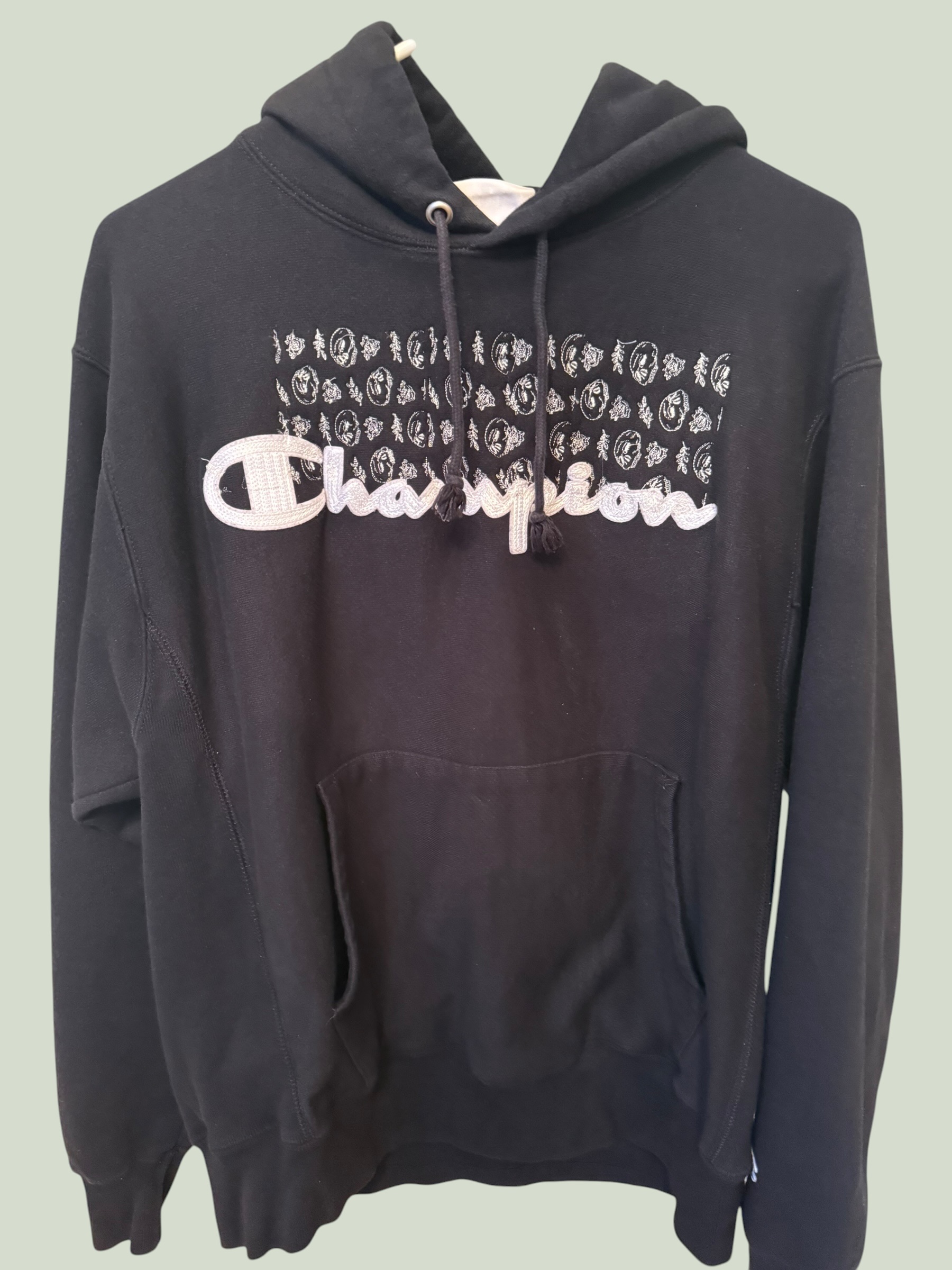 Black Champion double-weave hoodie with skull and rose embroidery, multiple angles