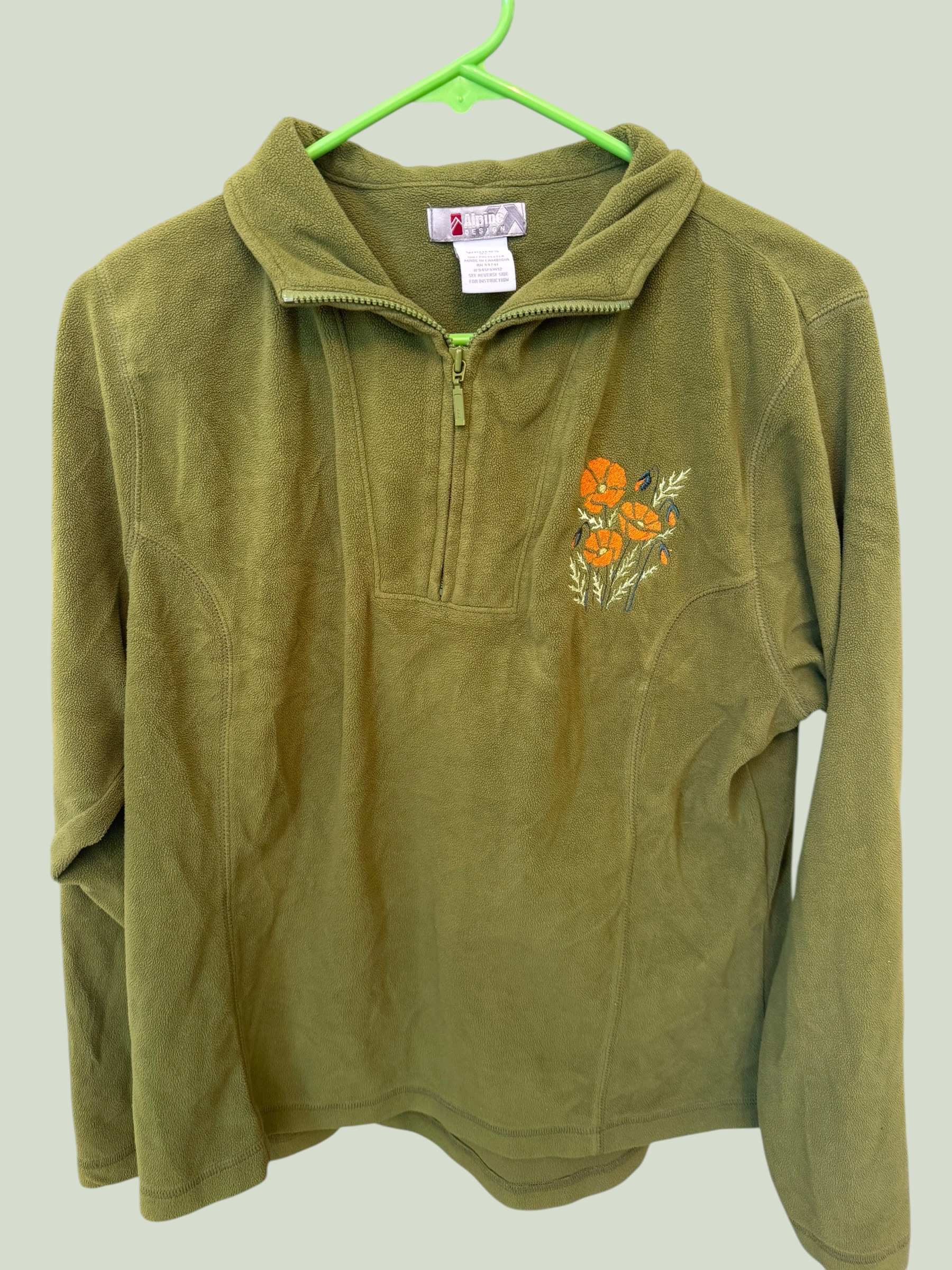 Alpine Design green quarter-zip with custom poppy flower embroidery, multiple angles