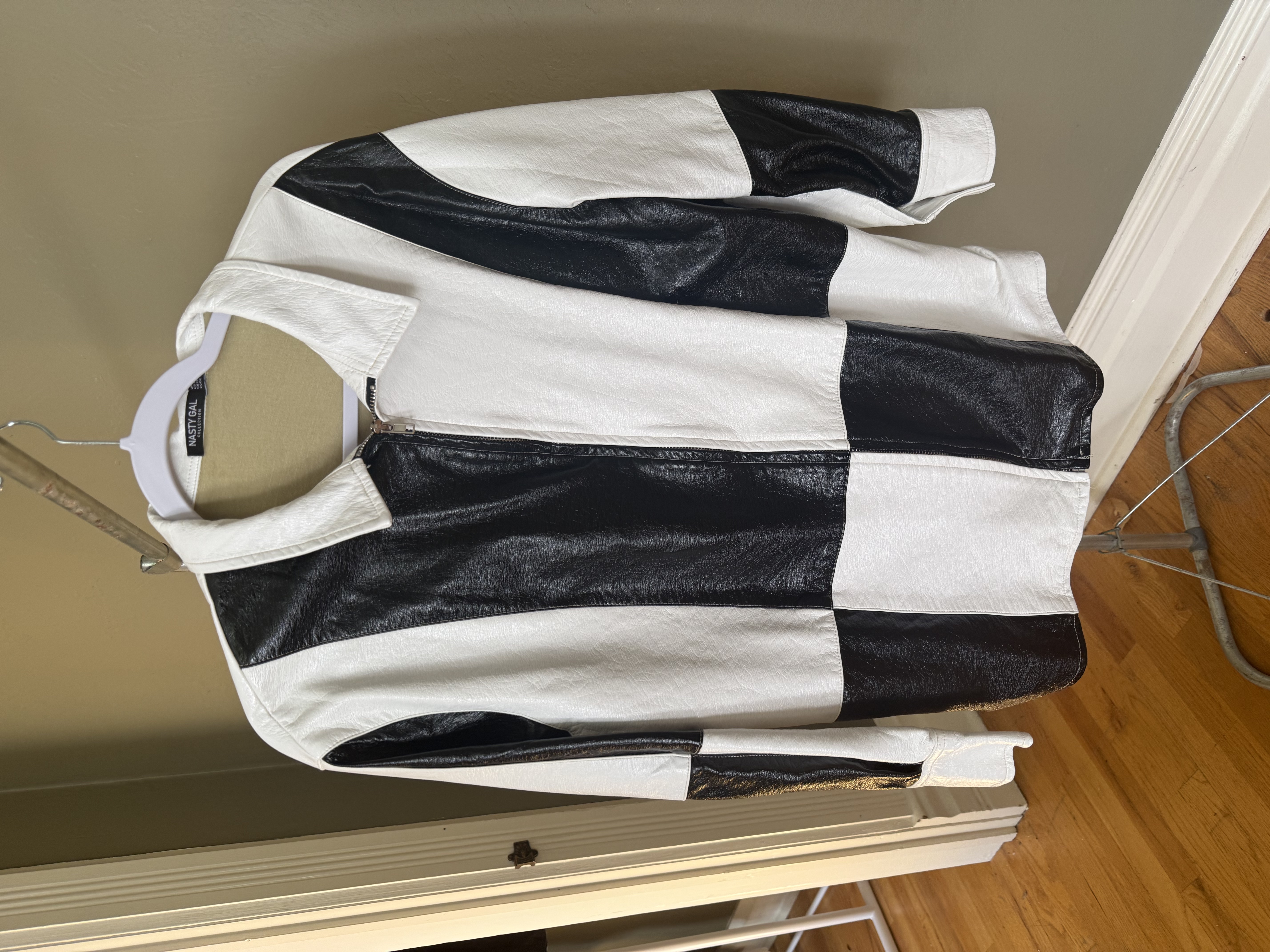 Nasty Gal black and white color-block leather jacket, front and back views with brand tag