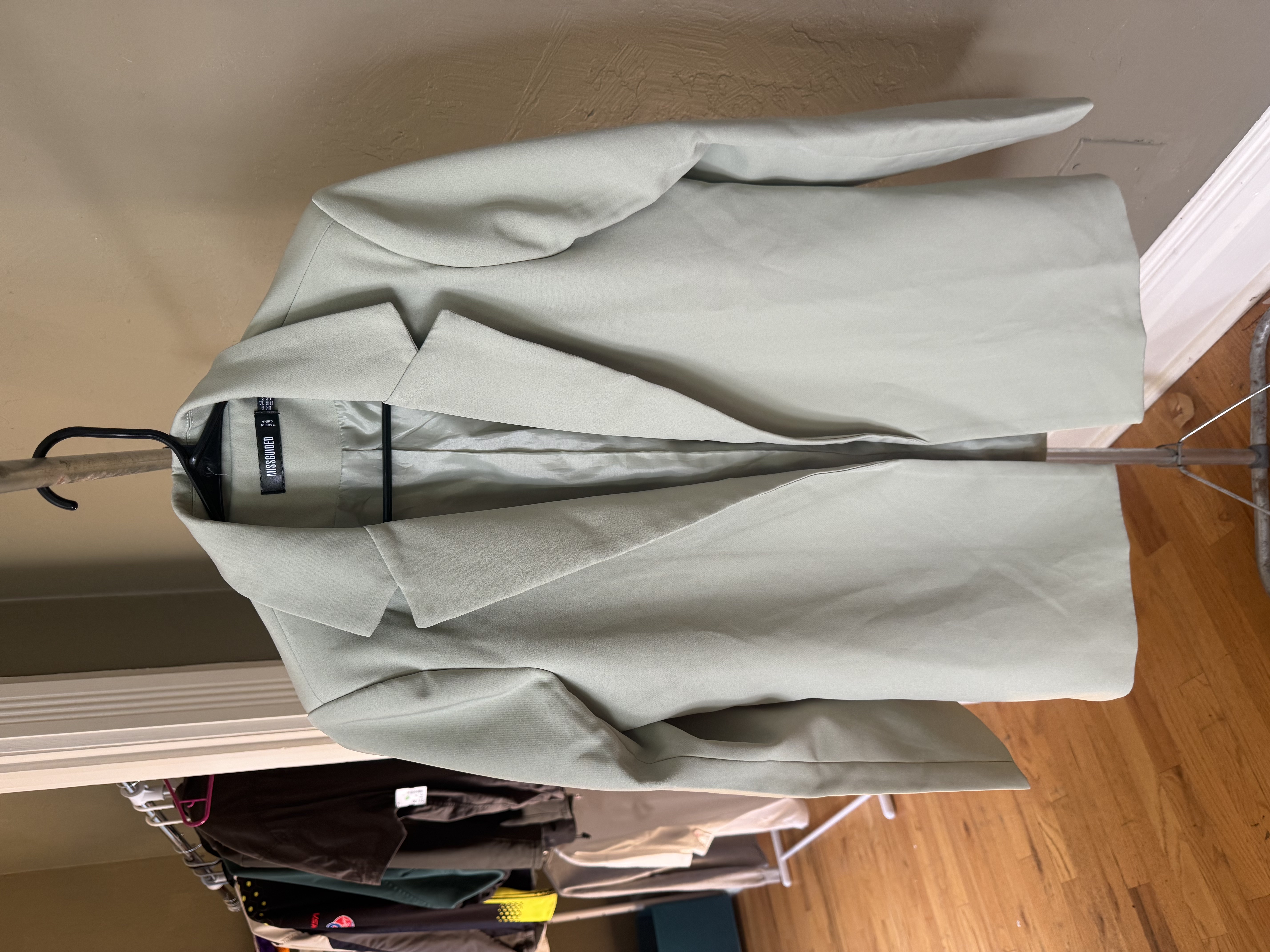Missguided sage green open-front blazer, front and back views with brand tag