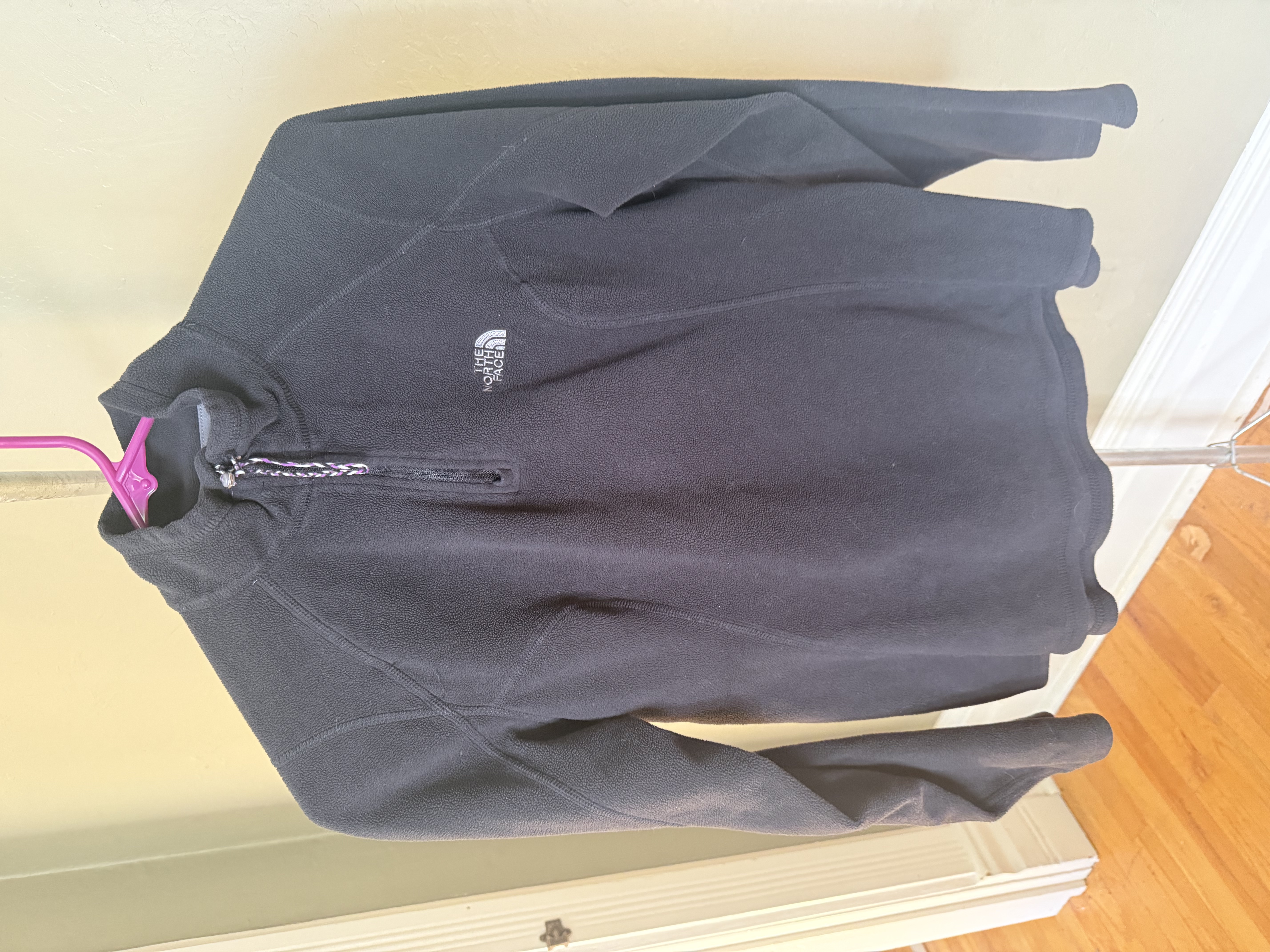 The North Face gray polyester quarter-zip fleece, two angles