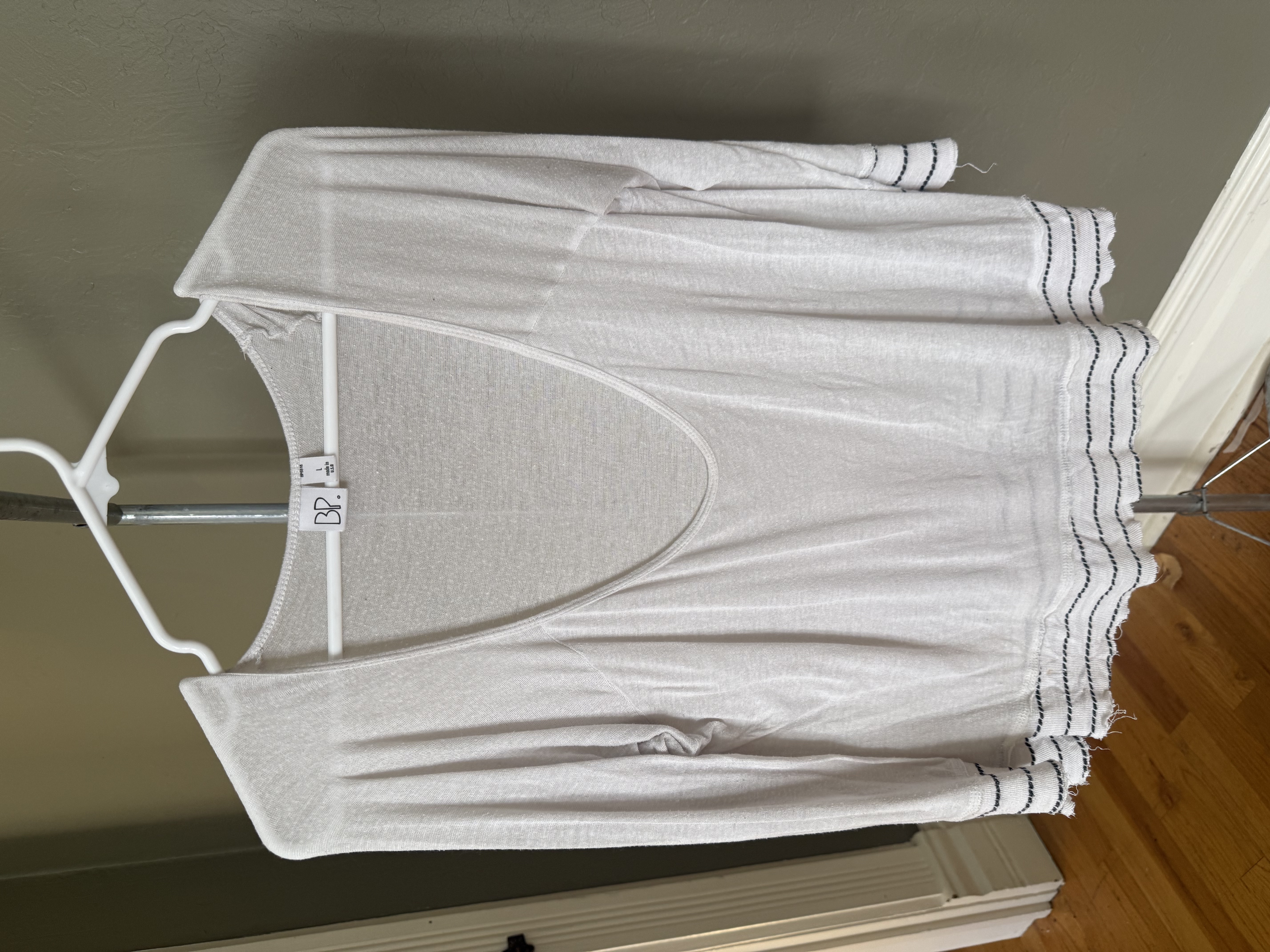 BP white linen top with black trim on sleeves and hem, multiple angles