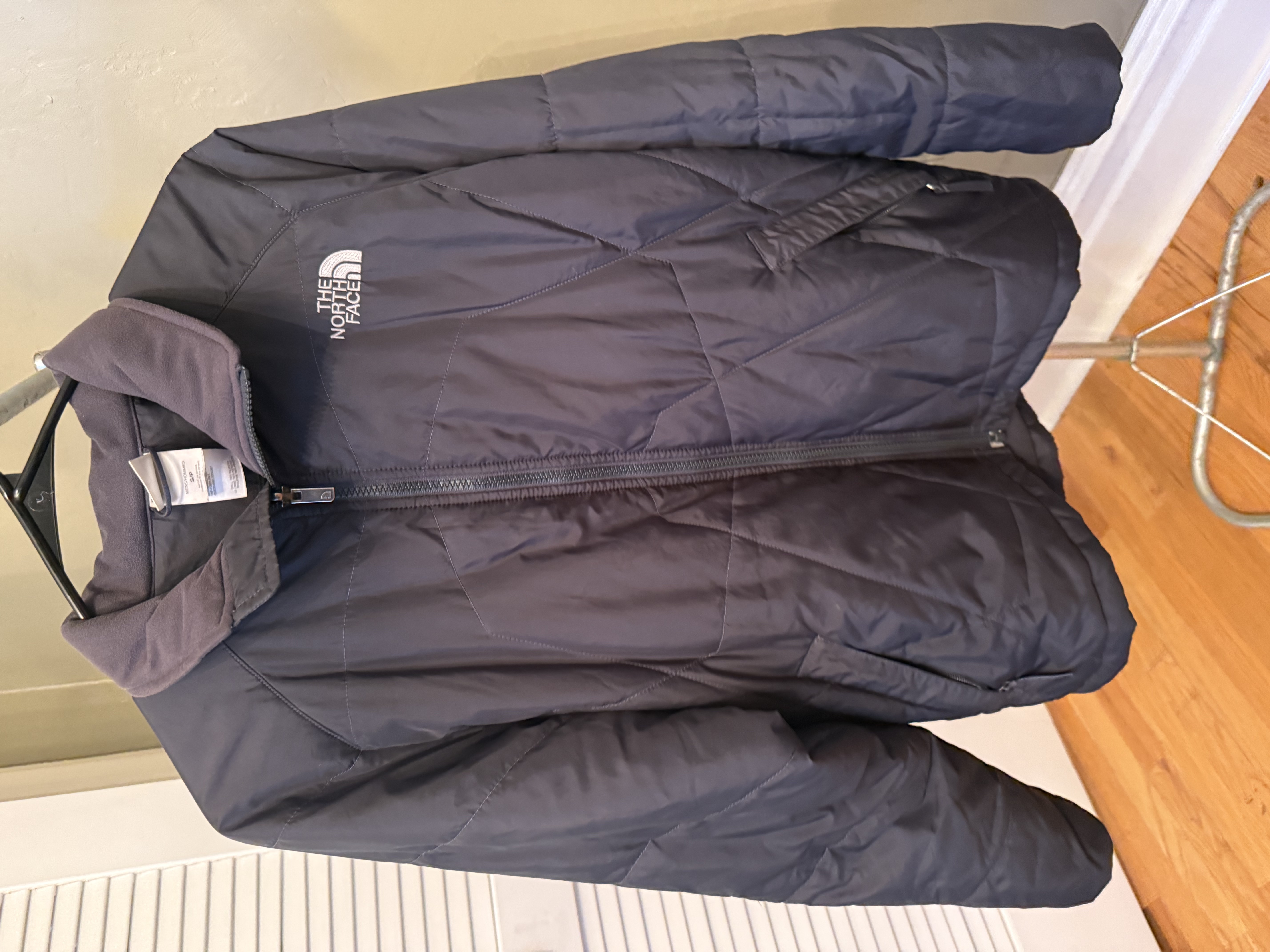 The North Face black zip-up jacket, multiple angles